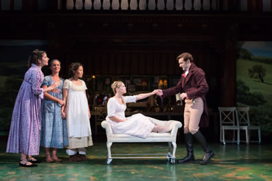 The Dashwoods wear simple early Victorian country print gowns, mom in purple, Elinor in blue, Margaret in tan with a white smock, Margaret in white, and she's sitting with her feet up in a settee (the others standing behind her) with her outstretched hand holding that of Willoughby in red coat, tan britches, and black knee boots.